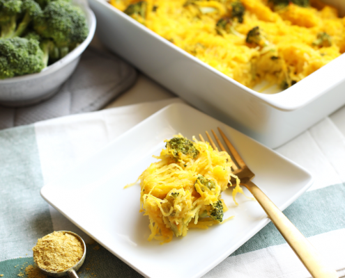 This Broccoli "Cheese" Spaghetti Squash Bake is a great way to celebrate fall comfort food with none of the guilt! With a cheese sauce made from butternut squash this is Paleo and Whole30!